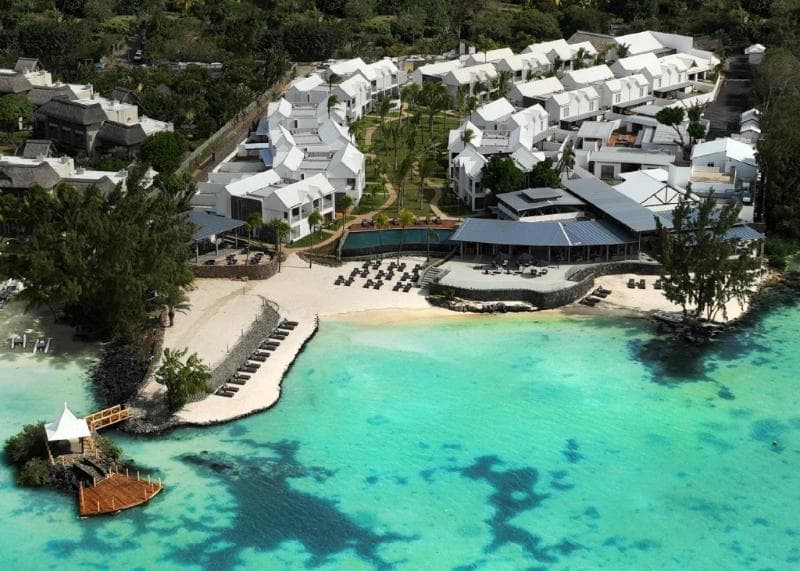 Aerial view of Sea Diamond, white buildings, a beach and a turquoise lagoon